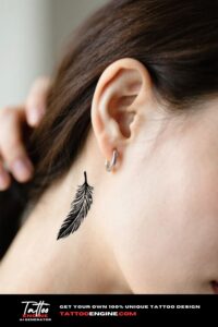 An extreme close-up of a phoenix tail feather tattoo behind a woman's ear.
