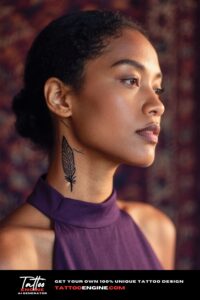 A woman's neck with a small tribal feather tattoo behind her ear, with a tapestry background.