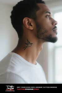 Close-up of a minimalist bird tattoo on the side of a man's neck wearing a white t-shirt.
