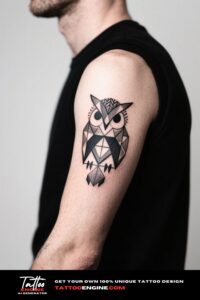 Close-up of a man's forearm with a geometric owl tattoo in a light grey polo shirt.