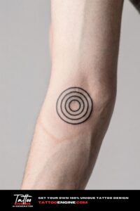 Close-up of a man's inner forearm with a minimalist geometric tattoo in a white dress shirt.