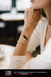 Tiny minimalist raven tattoo on a woman's wrist