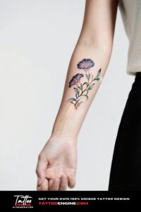 A delicate morning glory vine tattoo on a woman's wrist.