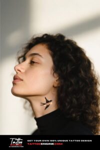 Side view of a woman's neck with a bird tattoo, wearing a black turtleneck.