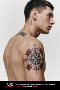 Close-up of an arm with a compass and roses tattoo in black and grey