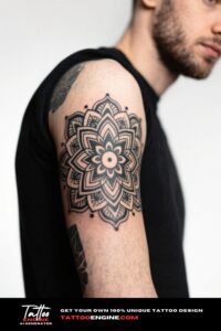 Close-up of a forearm with a detailed mandala tattoo in black and grey