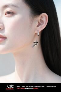 A close-up of a woman's neck with a star tattoo wearing a silver earring