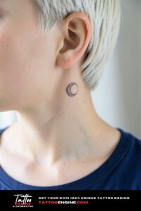 Tiny crescent moon with dotwork halo tattoo behind ear on porcelain skin, window light.