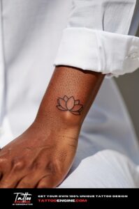 Black single-line lotus tattoo on outer wrist, deep brown skin and crisp shirt.
