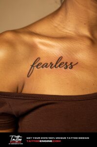 A woman&rsquo;s collarbone with a healed script tattoo "fearless", tank top strap slipped off.