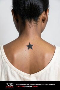 Solid black star tattoo at the base of a woman's neck above the spine.