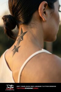 Two overlapping shaded star tattoos at the hairline on the neck.