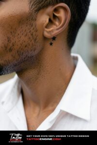 Three solid black stars tattooed in an arc below a man's left ear.