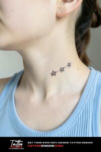 Two tiny black outlined stars tattooed diagonally below a girl's jaw.