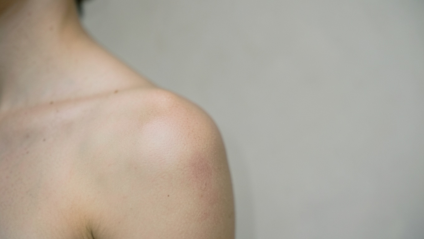A settled, healed shoulder tattoo in even soft light
